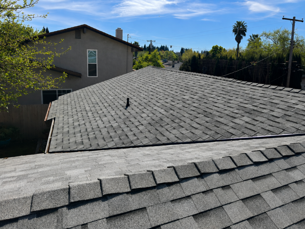 Sacramento Roofing in Summer Heat Gray asphalt shingle roof in strong Sacramento summer sun